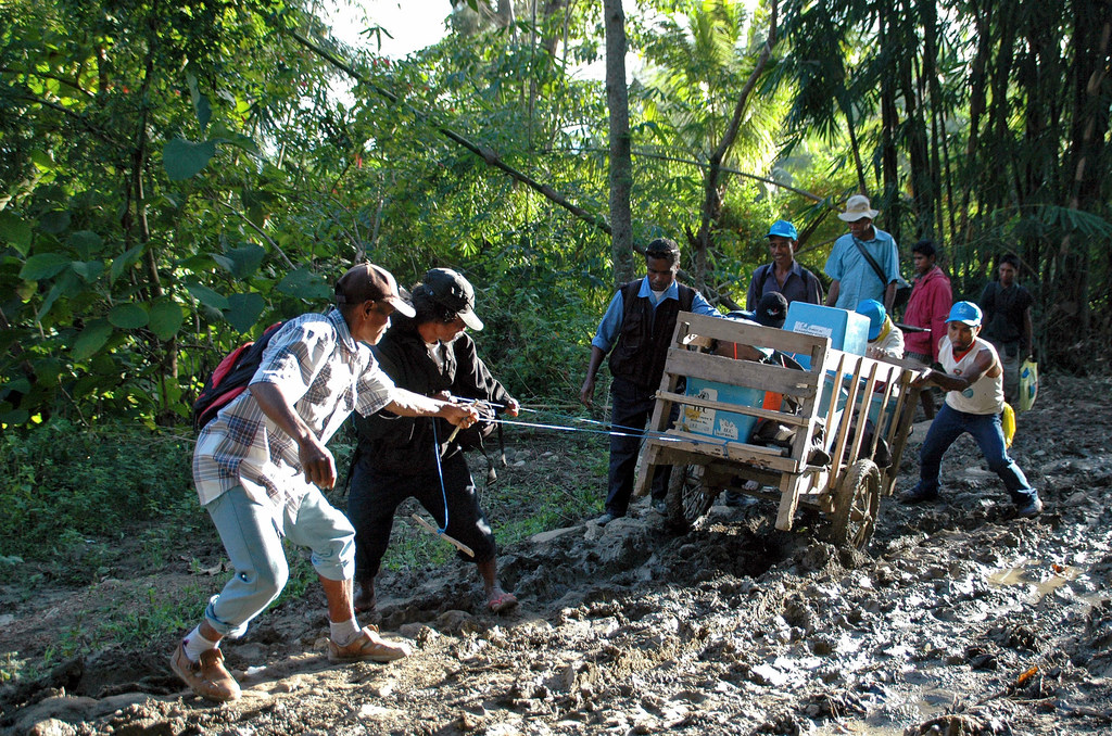 Officers of the Technical Secretariat for Electoral Administration drag a cart full of ballot boxes for distribution in remote communities of Timor-Leste, in preparation of elections in 2007. (file) Officers of the Technical Secretariat for Electoral Administration drag a cart full of ballot boxes for distribution in remote communities of Timor-Leste, in preparation of elections in 2007. (file)