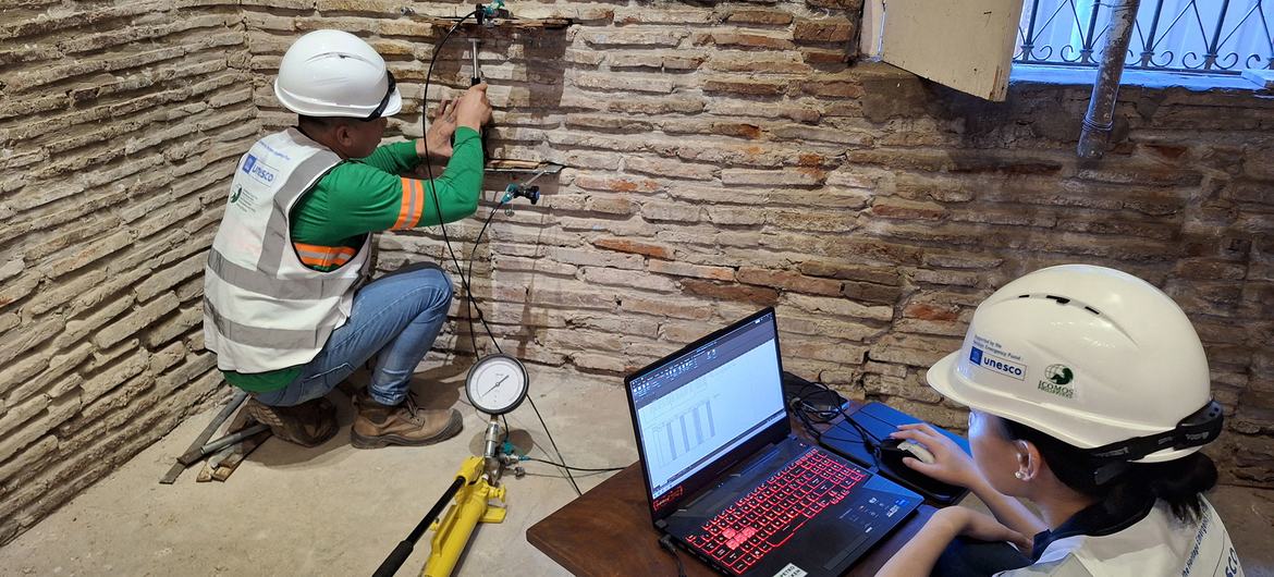 Technicians assess the structure of an historic building in Vigan. Technicians assess the structure of an historic building in Vigan.