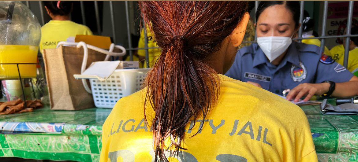A woman at Iligan City Jail has a health consultation. A woman at Iligan City Jail has a health consultation.