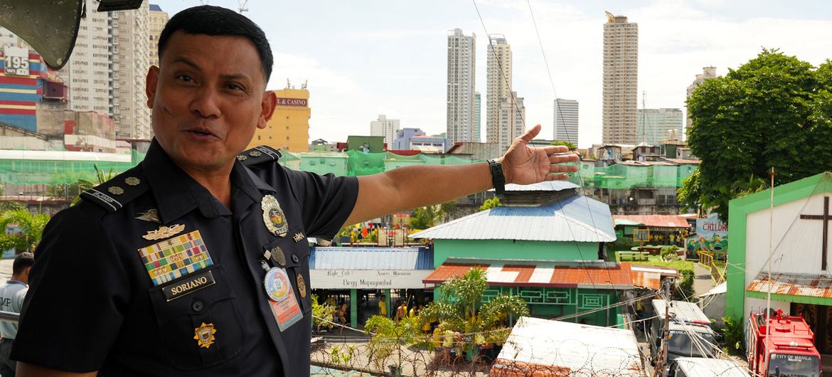 Warden Lino Montano Soriano gestures across the Manila City Jail compound. Warden Lino Montano Soriano gestures across the Manila City Jail compound.