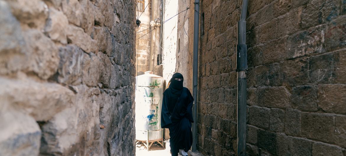 Harbiya al-Hamiry, a Yemeni heritage engineer walking around Old Sana'a. Harbiya al-Hamiry, a Yemeni heritage engineer walking around Old Sana'a.