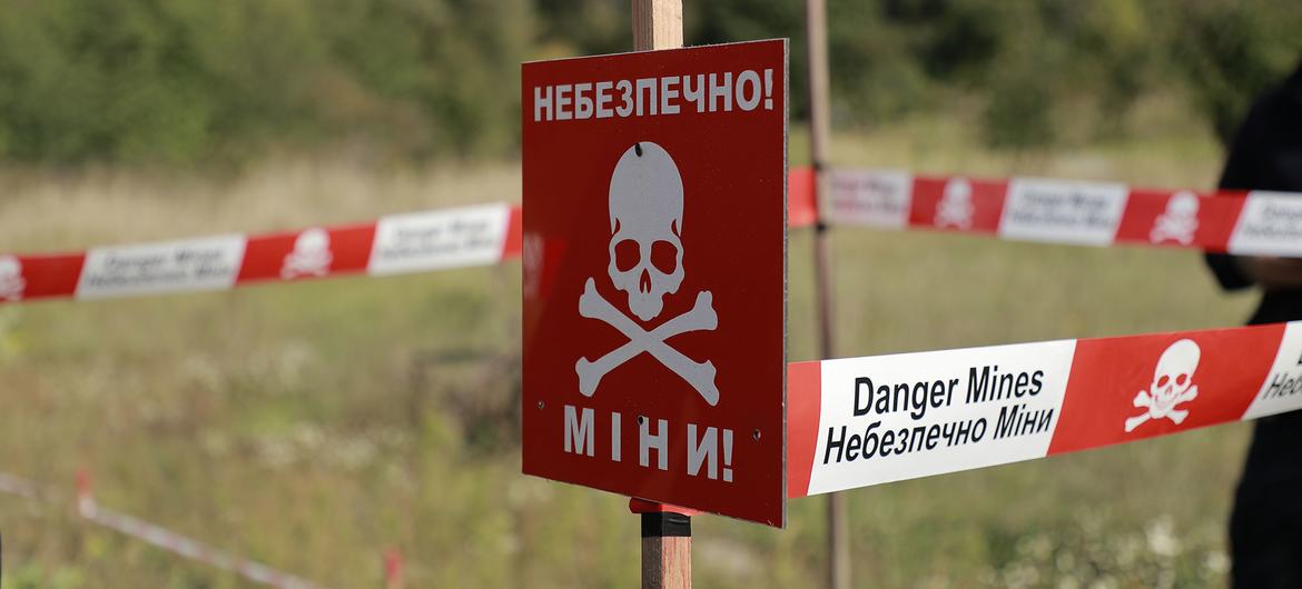 A sign in Ukraine warns of landmines. A sign in Ukraine warns of landmines.