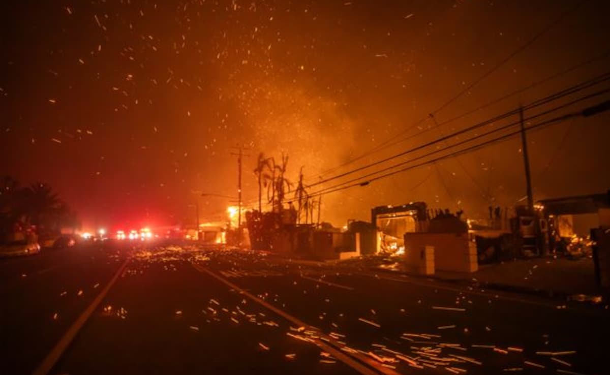 Strong winds blow embers as the Palisades Fire burns homes on the Pacific Coast Highway. Strong winds blow embers as the Palisades Fire burns homes on the Pacific Coast Highway.
