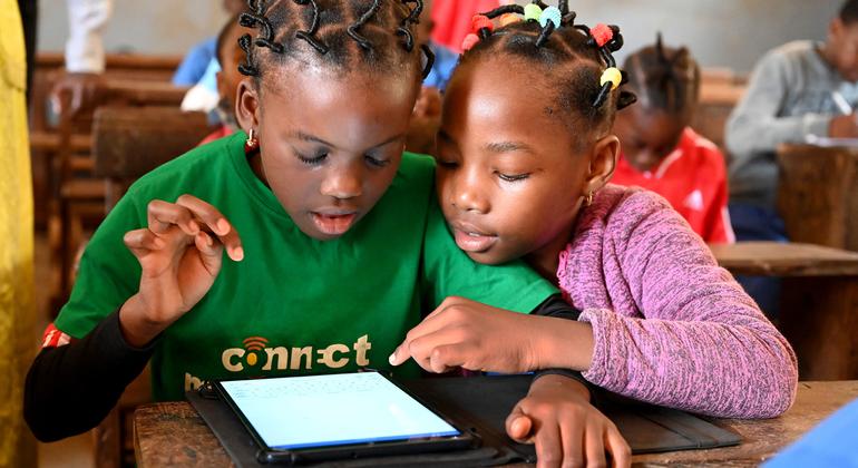 Children learn with tablets in the Public Melen School of Yaoundé, Cameroon. Children learn with tablets in the Public Melen School of Yaoundé, Cameroon.