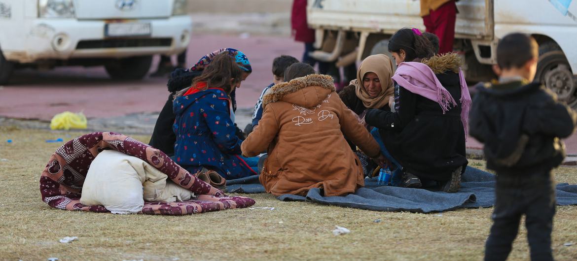 A family gathers at a reception centre in Ar-Raqqa city, Syria. A family gathers at a reception centre in Ar-Raqqa city, Syria.