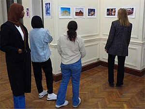 The guests are looking at the photos with interest