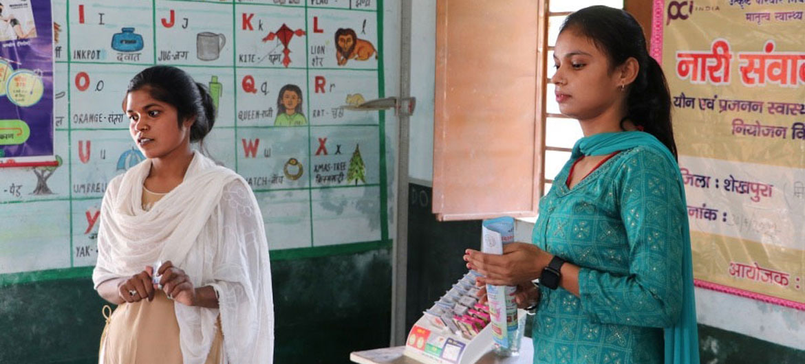 Two community workers provide information about contraceptives in Bihar, India. Two community workers provide information about contraceptives in Bihar, India.