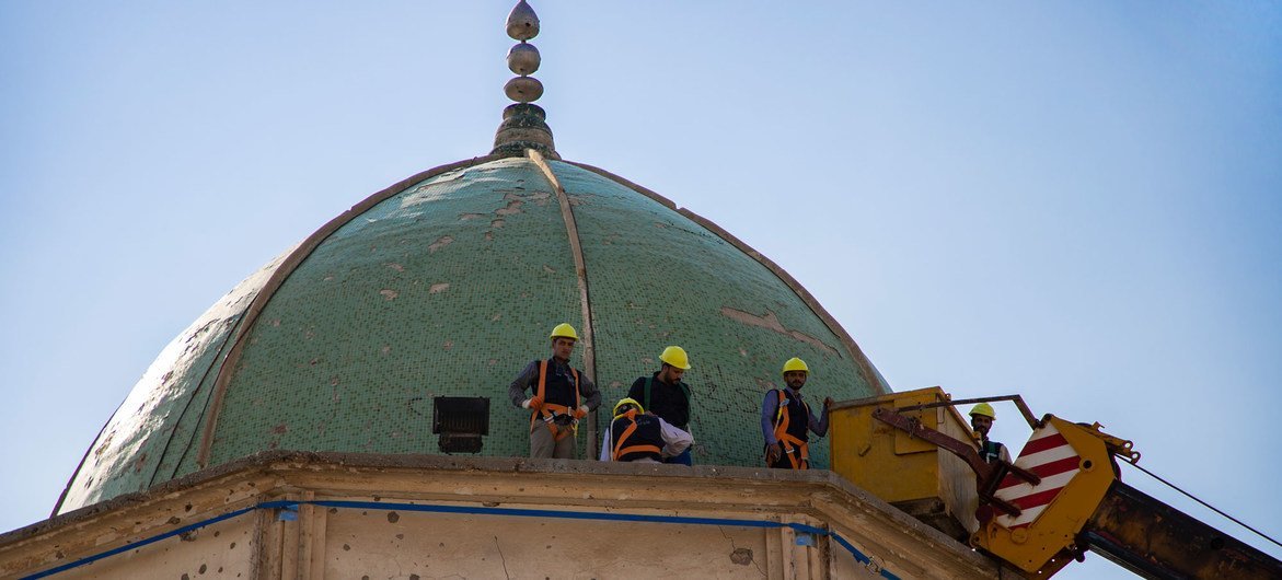 Workers repair part of the Al-Nouri Mosque in Mosul. Workers repair part of the Al-Nouri Mosque in Mosul.