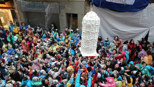 A giant, human-sized dessert gets dropped into the crowd A giant, human-sized dessert gets dropped into the crowd