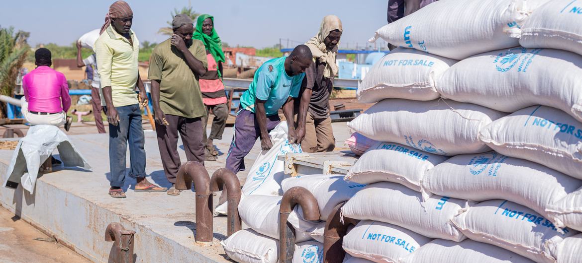Sudan. Offloading of barge transported food aid Sudan. Offloading of barge transported food aid