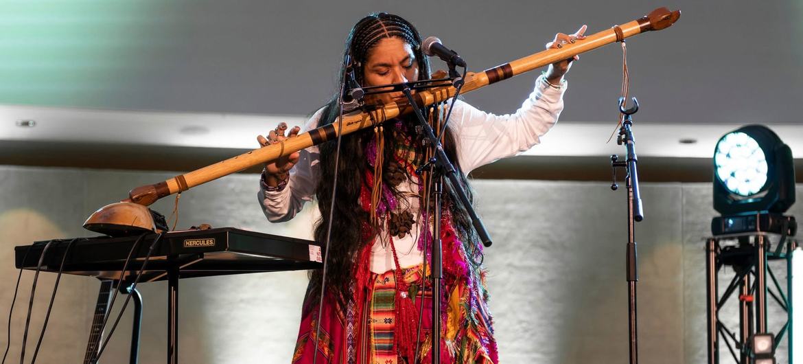 Brisa Flow playing a traditional instrument at the Stand Up for Social Justice concert in Geneva in February 2025. Brisa Flow playing a traditional instrument at the Stand Up for Social Justice concert in Geneva in February 2025.