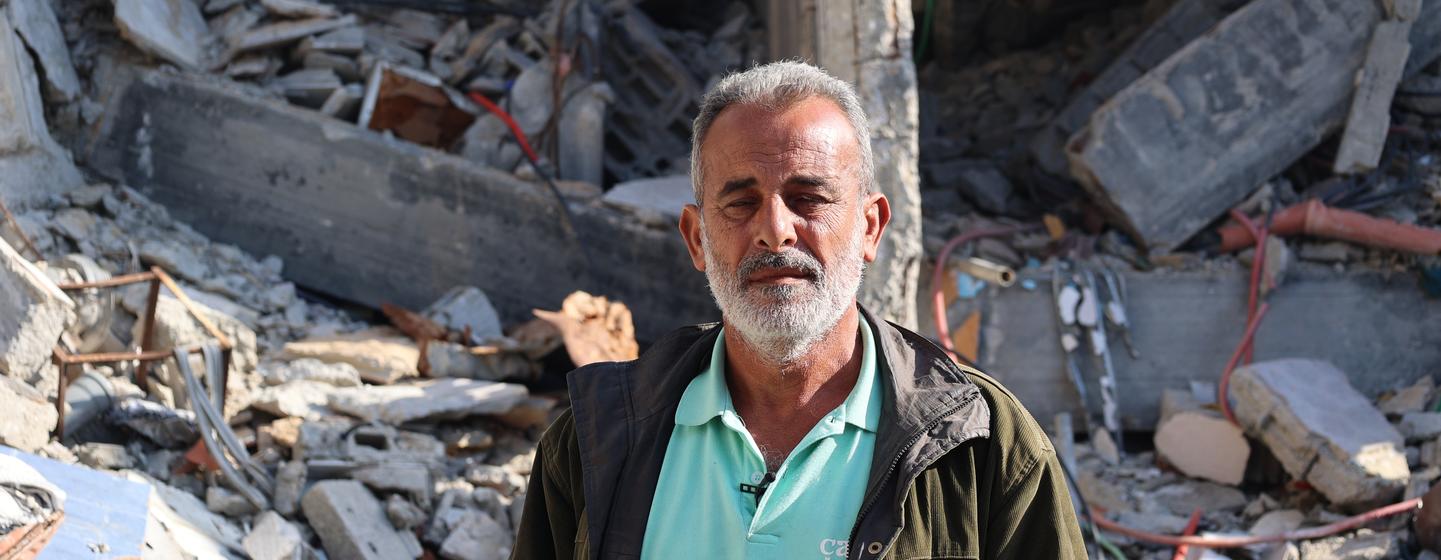 Yasser Ahmed stands in front of his destroyed home in Jabalia, in the north of the Gaza Strip. Yasser Ahmed stands in front of his destroyed home in Jabalia, in the north of the Gaza Strip.