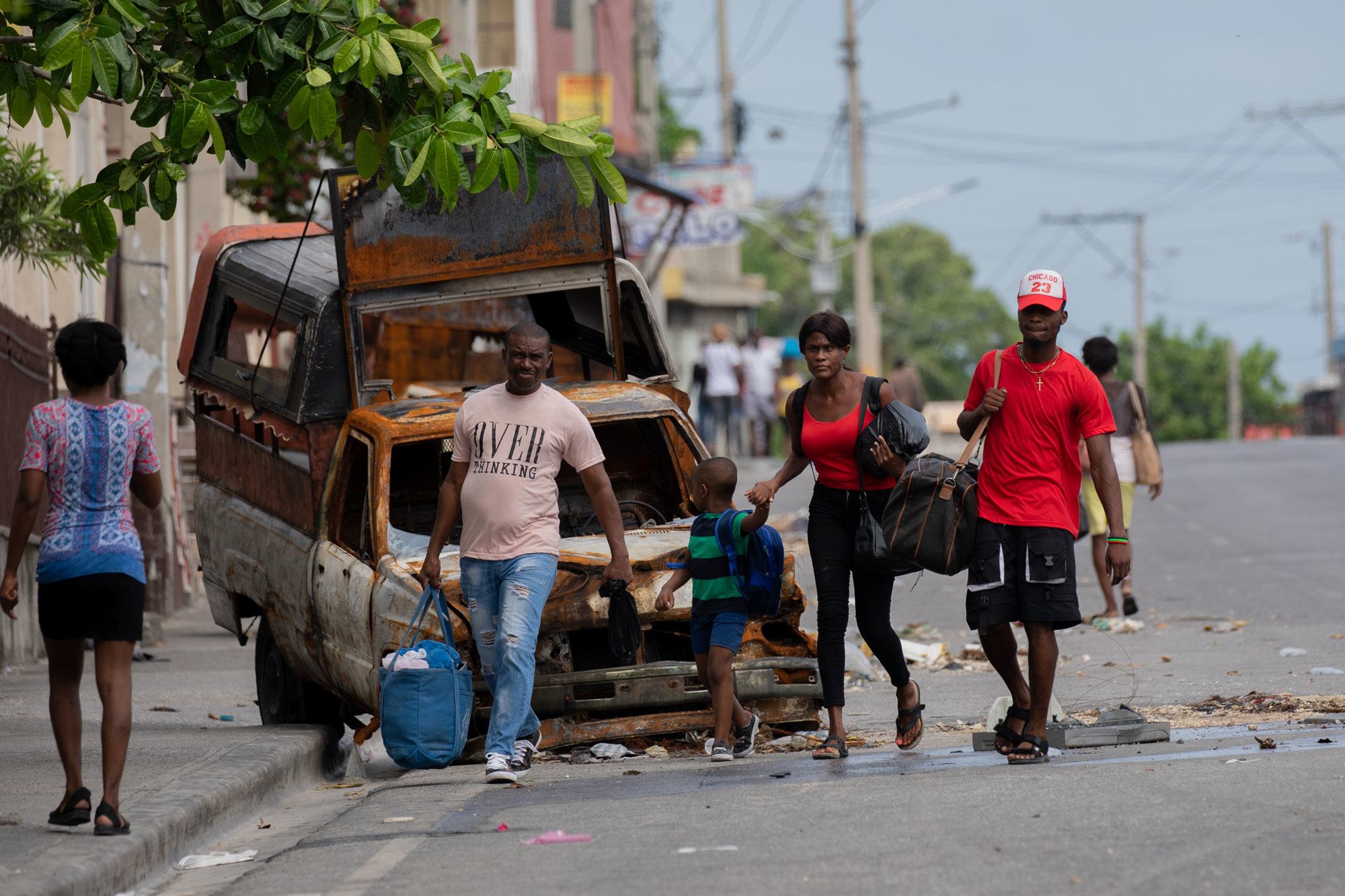 People flee the neighbourhood of Solino in Port-au-Prince following gang attacks there in May 2024. People flee the neighbourhood of Solino in Port-au-Prince following gang attacks there in May 2024.