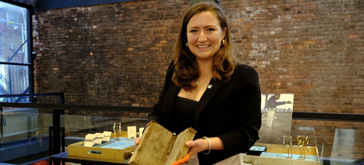 Kendall Silwonuk at an Article 22 pop-up shop in New York with an array of jewellery made of remnants of war. Kendall Silwonuk at an Article 22 pop-up shop in New York with an array of jewellery made of remnants of war.