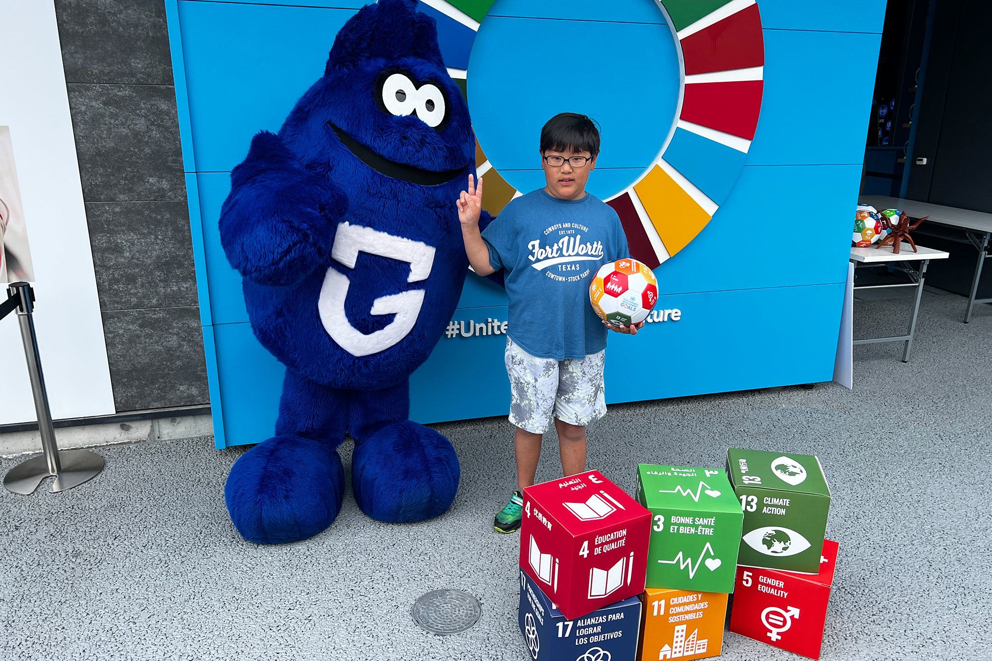 A boy participates in an event at the UN pavilion to promote the SDGs. A boy participates in an event at the UN pavilion to promote the SDGs.