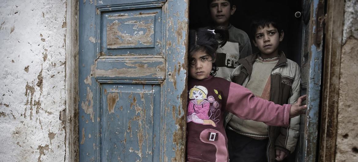 Children stand in the doorway of a home in a poverty stricken neighborhood in Lebanon. (file) Children stand in the doorway of a home in a poverty stricken neighborhood in Lebanon. (file)