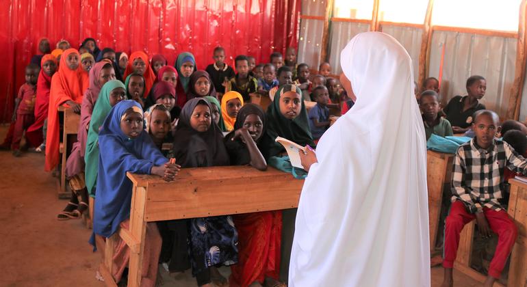 A teacher stands before a classroom in Somalia. A teacher stands before a classroom in Somalia.