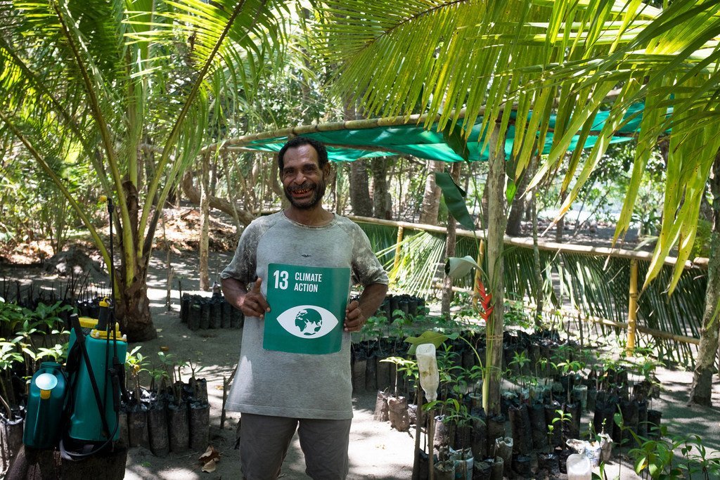 Papuan conservationist Alfred Masul is replanting mangrove trees to build resilience against climate change (file) Papuan conservationist Alfred Masul is replanting mangrove trees to build resilience against climate change (file)