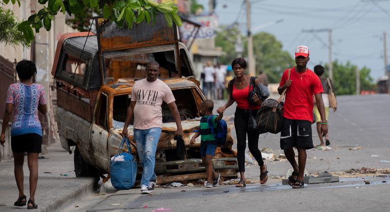 People flee the neighbourhood of Solino in Port-au-Prince following gang attacks there in May 2024. People flee the neighbourhood of Solino in Port-au-Prince following gang attacks there in May 2024.