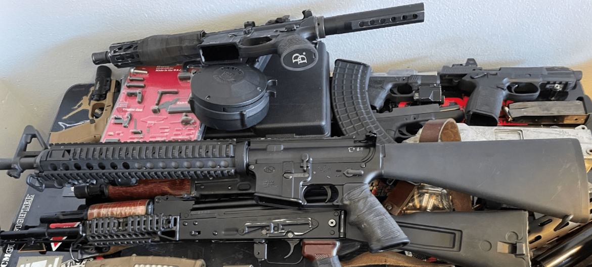 Weapons seized by US law enforcement authorities which were destined for Haiti are put on show. Weapons seized by US law enforcement authorities which were destined for Haiti are put on show.