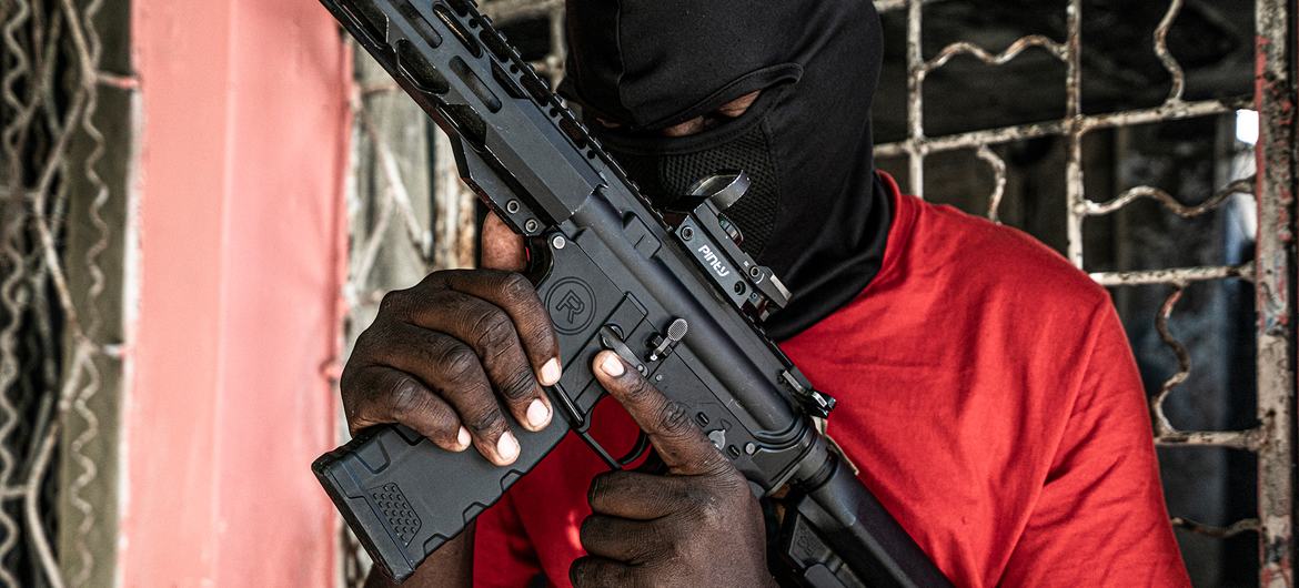 A gang member poses in the Delmas 3 area of Port-au-Prince.