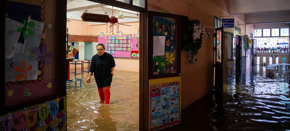 A teacher inspects the damage in a kindergarten classroom at a school in Thailand. A teacher inspects the damage in a kindergarten classroom at a school in Thailand.