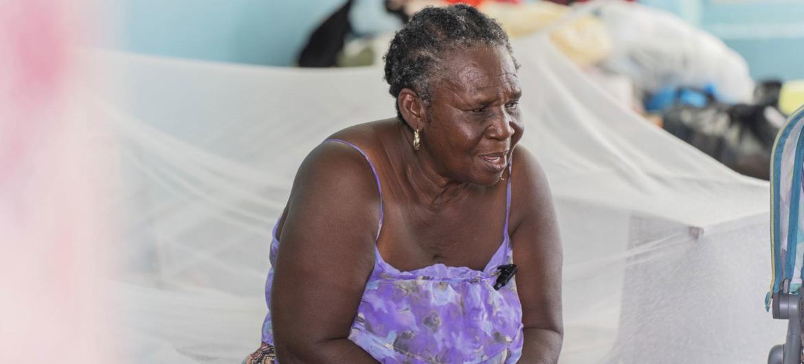 Sonia sits on a bed at a shelter for people who lost their homes due to Hurricane Melissa. Sonia sits on a bed at a shelter for people who lost their homes due to Hurricane Melissa.