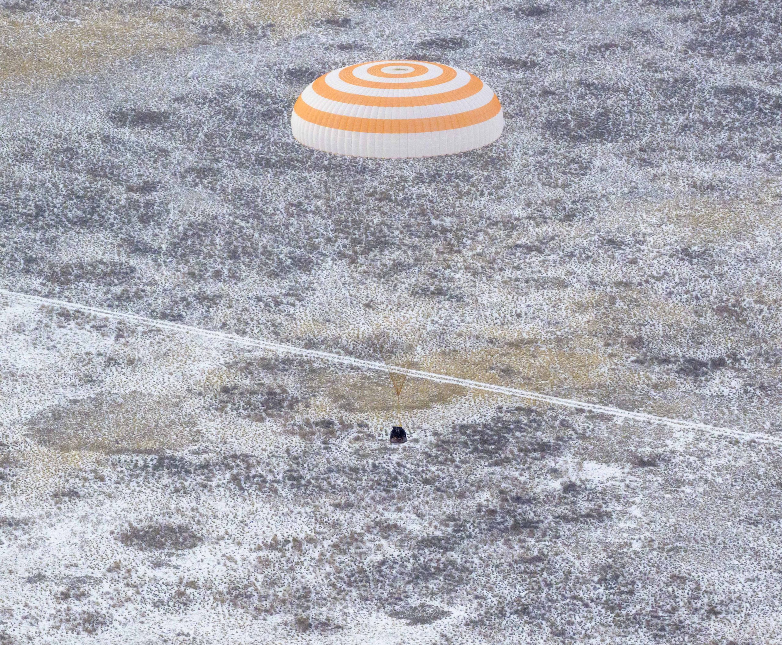 The Soyuz MS-27 spacecraft is seen as it lands in a remote area near the town of Zhezkazgan, Kazakhstan with Expedition 73 NASA astronaut Jonny Kim, and Roscosmos cosmonauts Sergey Ryzhikov, and Alexey Zubritsky aboard, Tuesday, Dec. 9, 2025. The trio are returning to Earth after logging 245 days in space as members of Expeditions 72 and 73 aboard the International Space Station.