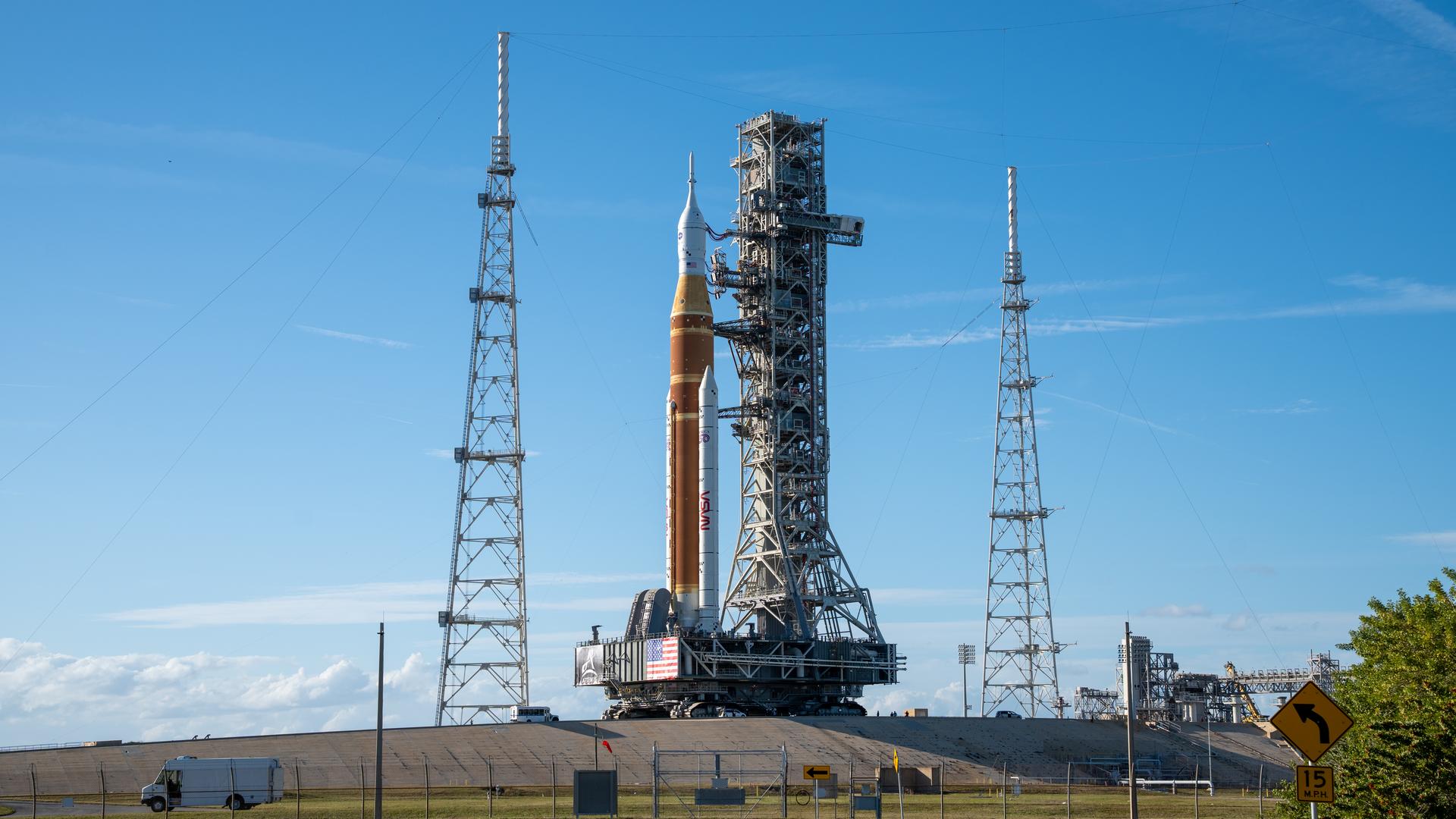 This image shows NASA’s SLS (Space Launch System) and Orion spacecraft rolling out of the Vehicle Assembly Building at NASA’s Kennedy Space Center. NASA's massive Crawler-Transporter, upgraded for the Artemis program, carries the powerful SLS rocket and Orion spacecraft on the Mobile Launcher from the Vehicle Assembly Building to Launch Pad 39B at Kennedy Space Center in preparation for the Artemis II mission.