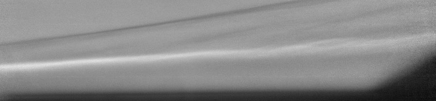 A shock wave interacting with a thin layer of fluid at Mach 10 in a wind tunnel, as captured by the Self-Aligned Focusing Schlieren (SAFS) system invented in 2020 by researchers at NASA’s Langley Research Center in Hampton, Virginia. Compared to conventional Schlieren imaging it eliminates irrelevant features such astunnel boundary layers, off-plane shockwaves, and flow structures from temperature variations outside the wind tunnel.