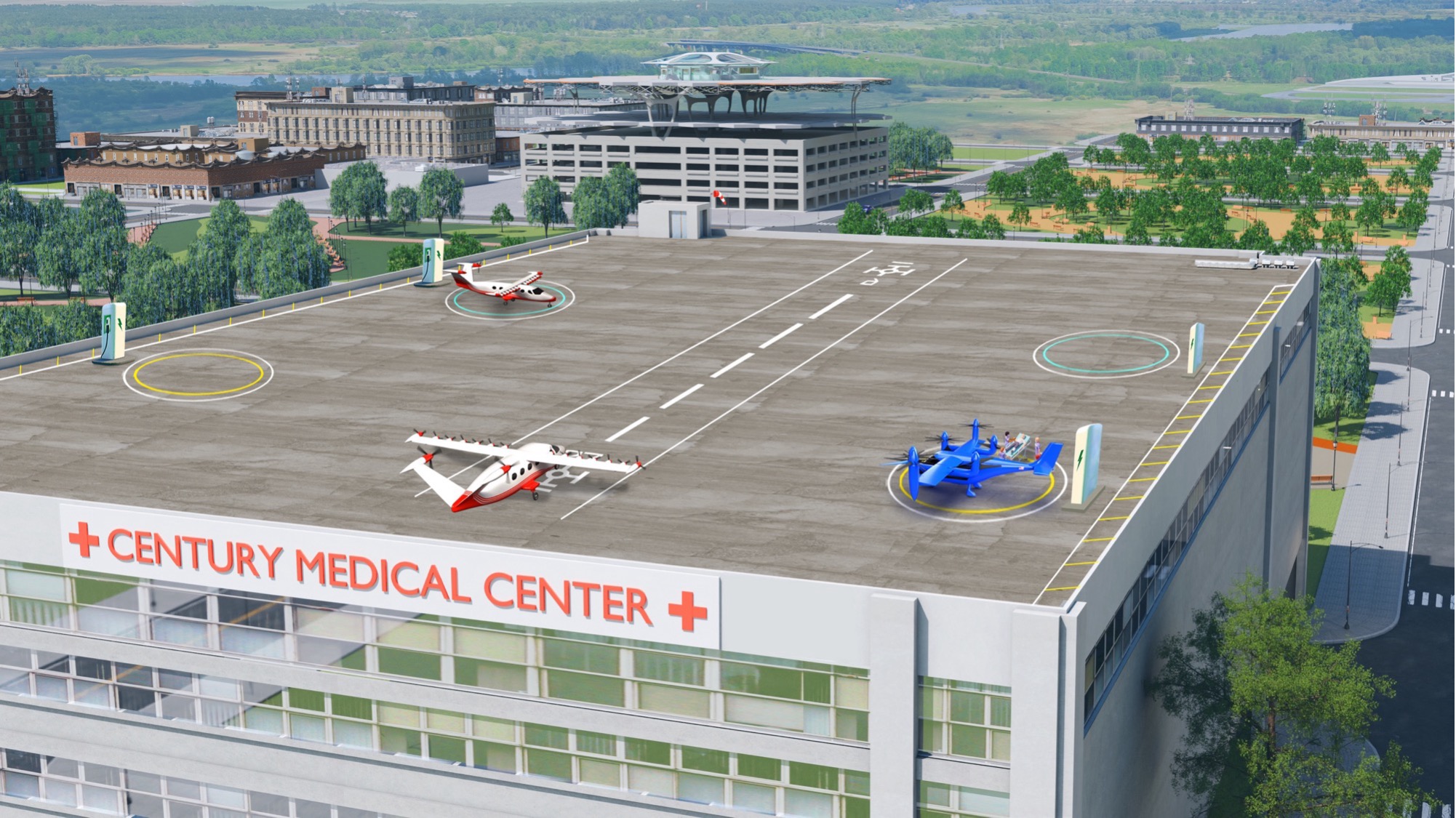 An artist’s concept image shows the square, gray rooftop of a hospital building with three concept aircraft sitting on top. One aircraft is painted dark blue, and two are painted with red and white paint schemes. Each aircraft has several unique propellors and wings to showcase that these aircraft can take off and land on short runways or vertically. The words “Century Medical Center” – in red – sit below the rooftop landing pad with several rows of windows underneath. In the background, there are several rows of trees, buildings, and parking garages, to show that this building is inside of a city.