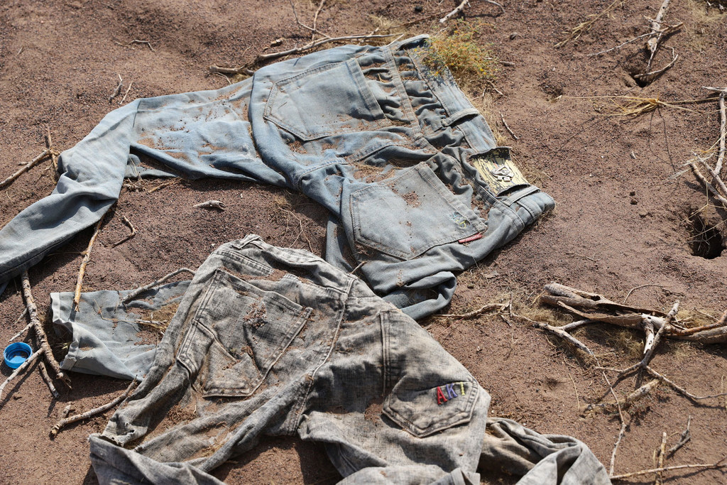 Clothes thought to be discarded by migrants lie in the Djibouti desert. Clothes thought to be discarded by migrants lie in the Djibouti desert.