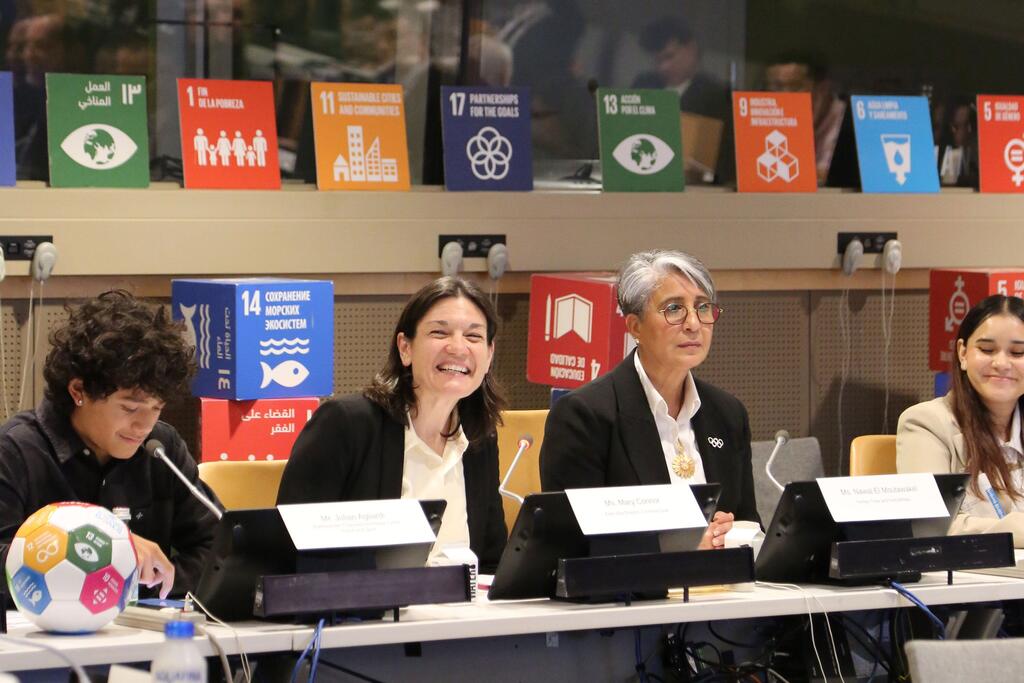 Mary Connor (2nd left) and Nawal El Moutawakal speaking at UN Headquarters Mary Connor (2nd from left) and Nawal El Moutawakal speaking at a panel discussion at UN Headquarters. The background features the Sustainable Development Goals (SDGs) banners.
