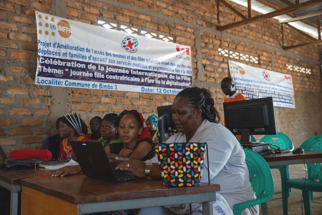 Women and girls attend a digital literacy course, supported by UNFPA, in Bangui, Central African Republic. Women and girls attend a computer literacy class at Boing Bimbo Safe Space for women and girls in Bangui, Central African Republic, supported by UNFPA.
