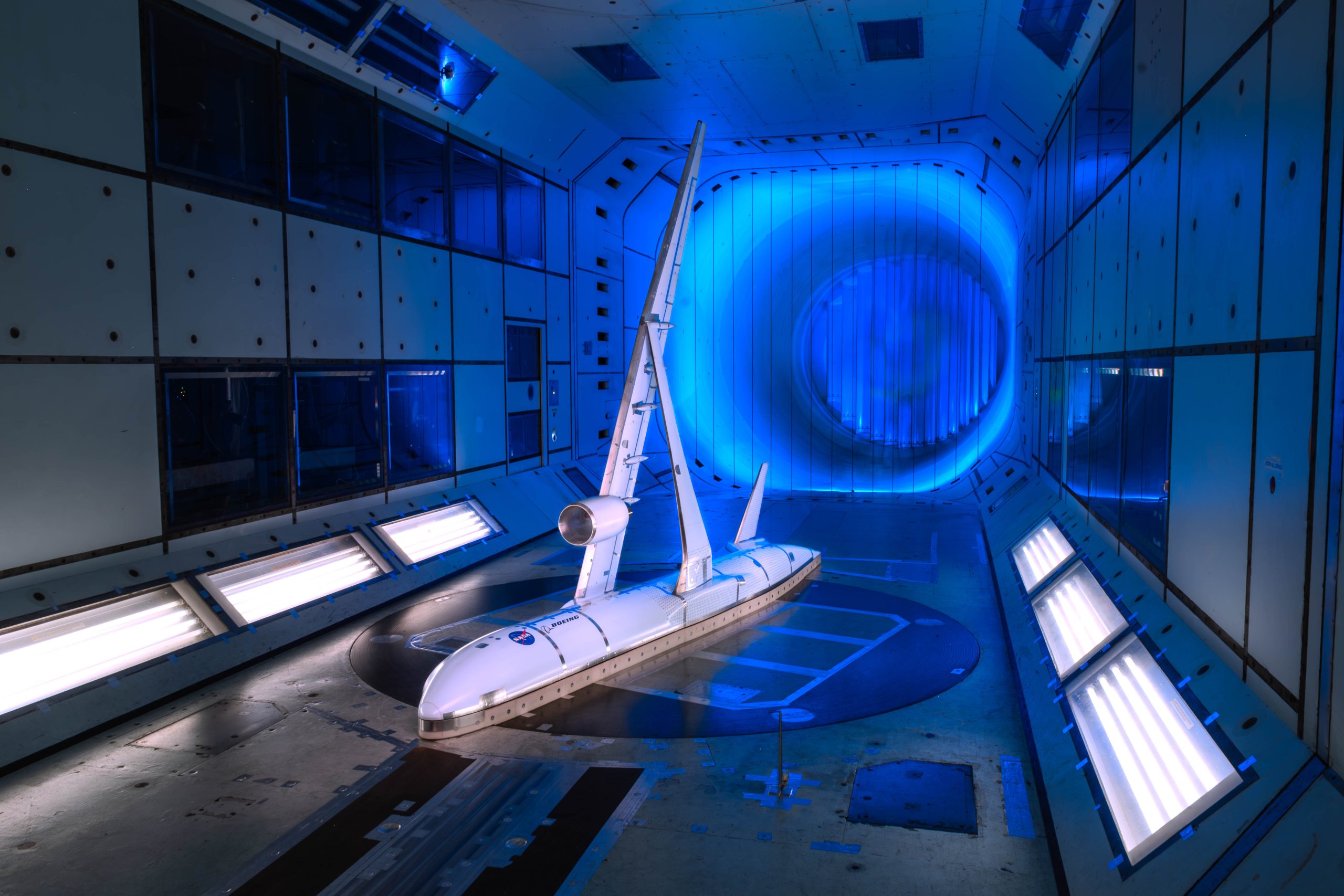 A scale model of a subsonic aircraft is tested inside a wind tunnel.