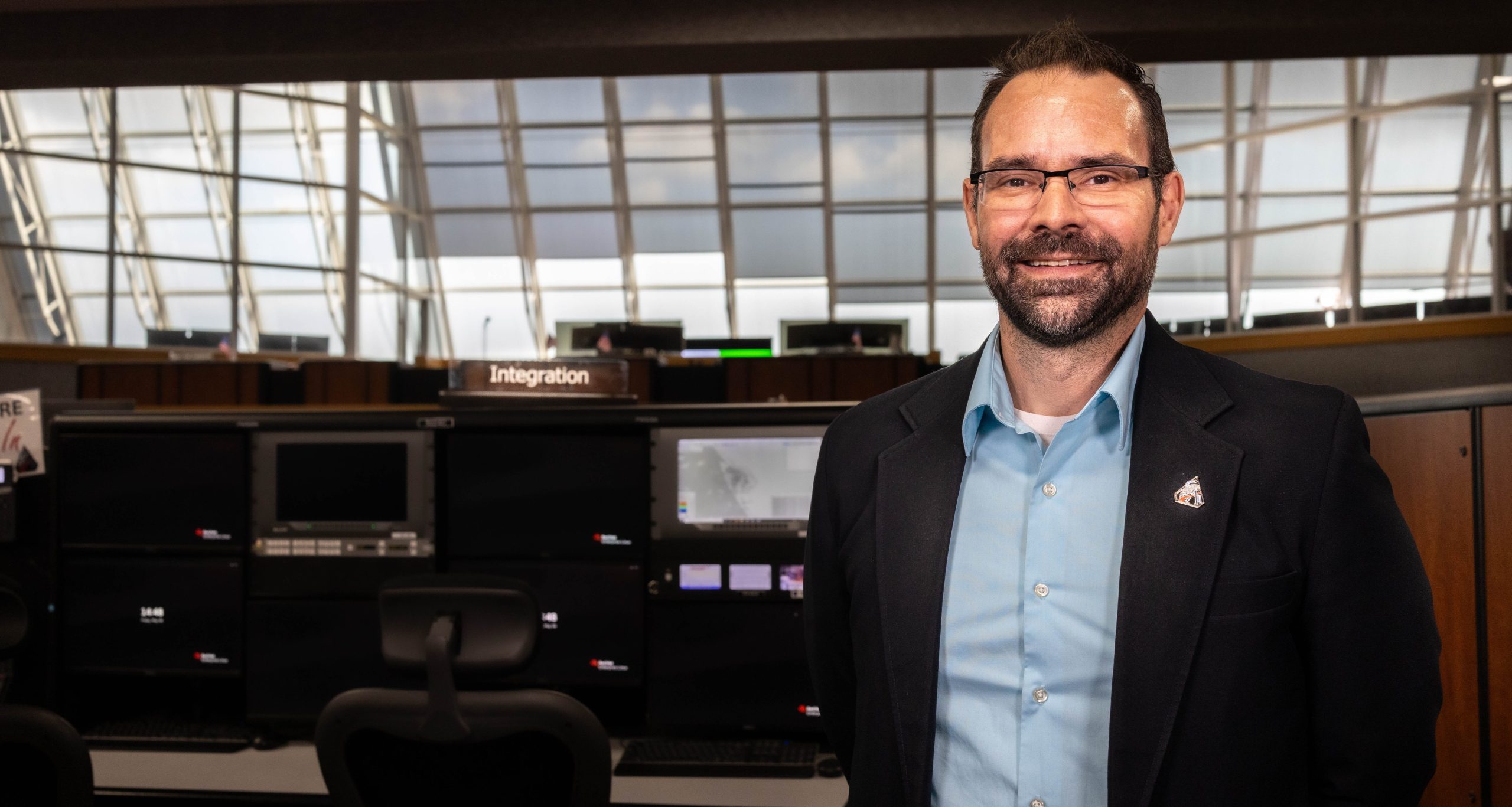 Portrait of NASA's Anton Kiriwas inside Firing Room 1 of the Launch Control Center at NASA's Kennedy Space Center in Florida